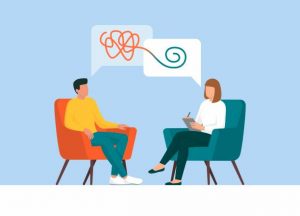 Therapist and patient talking together, she is helping him to cope with a stressful situation
